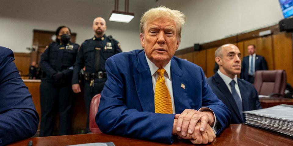 Donald Trump sitting in a courtroom.