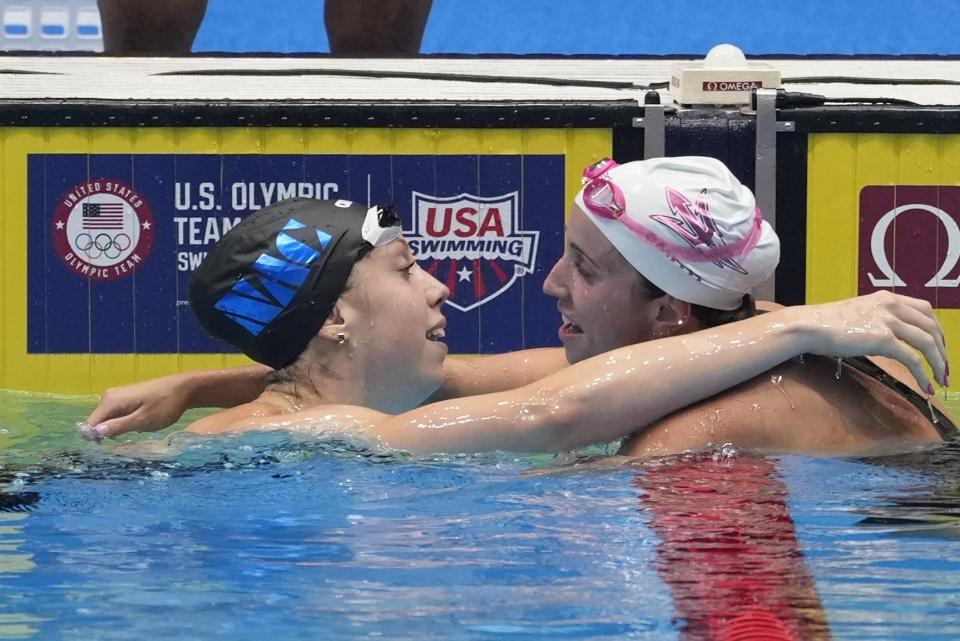 Gretchen Walsh is congratulated by Regan Smith after winning the Women's 100 butterfly finals Sunday, June 16, 2024, at the US Swimming Olympic Trials in Indianapolis. (AP Photo/Darron Cummings)