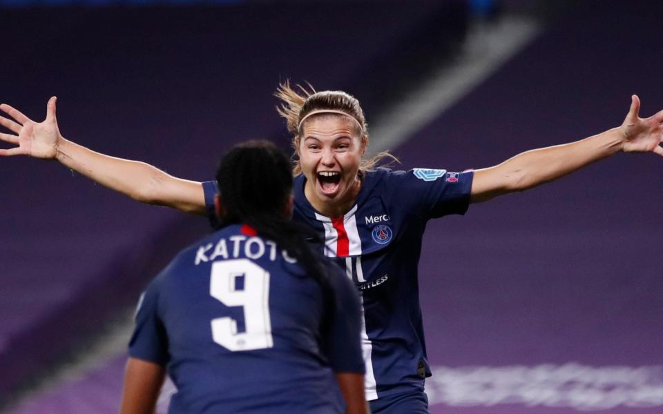 PSG's Signe Bruun, right, celebrates with Marie-Antoinette Katoto after scoring her team's 2nd goal during the Women's Champions League quarterfinal soccer match between Arsenal and Paris Saint-Germain at the Anoeta stadium in San Sebastian, - AP