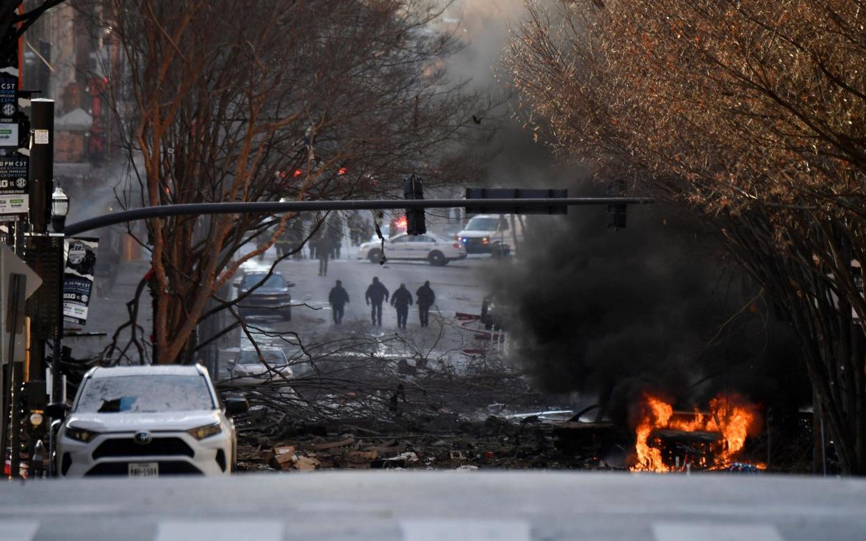 A vehicle burns near the site of an explosion in the downtown Nashville, Tennessee - Andrew Nelles/Tennessean.com/USA TODAY NETWORK via REUTERS