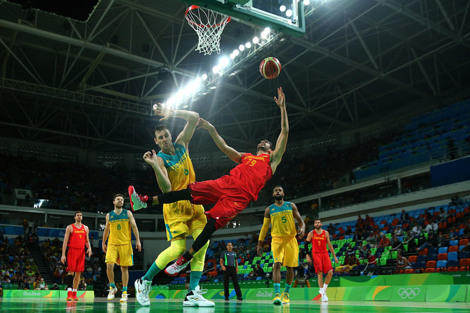 Andrew Bogut picks up his fifth foul defending Ricky Rubio on a drive to the basket. (Elsa/Getty Images)