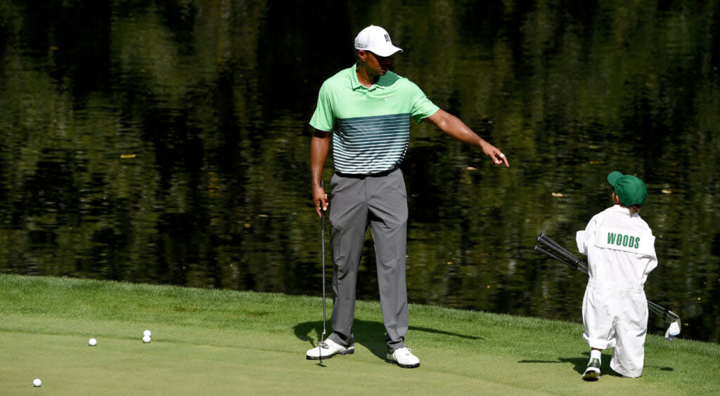 Tiger Woods of the United States with his son Charlie during the par three contest prior to the start of the 2015 Masters Tournament at Augusta National Golf Club on April 8, 2015 in Augusta, Georgia. (Photo by Ross Kinnaird/Getty Images)