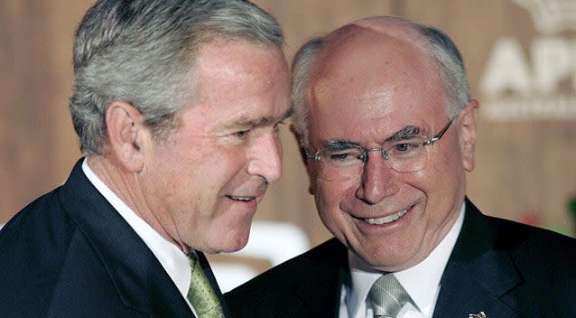 Former US president George Bush is greeted by former Australian Prime Minister John Howard at the Asia-Pacific Economic Cooperation leader's summit dinner in Sydney. Source: EPA/MICK TSIKAS/POOL