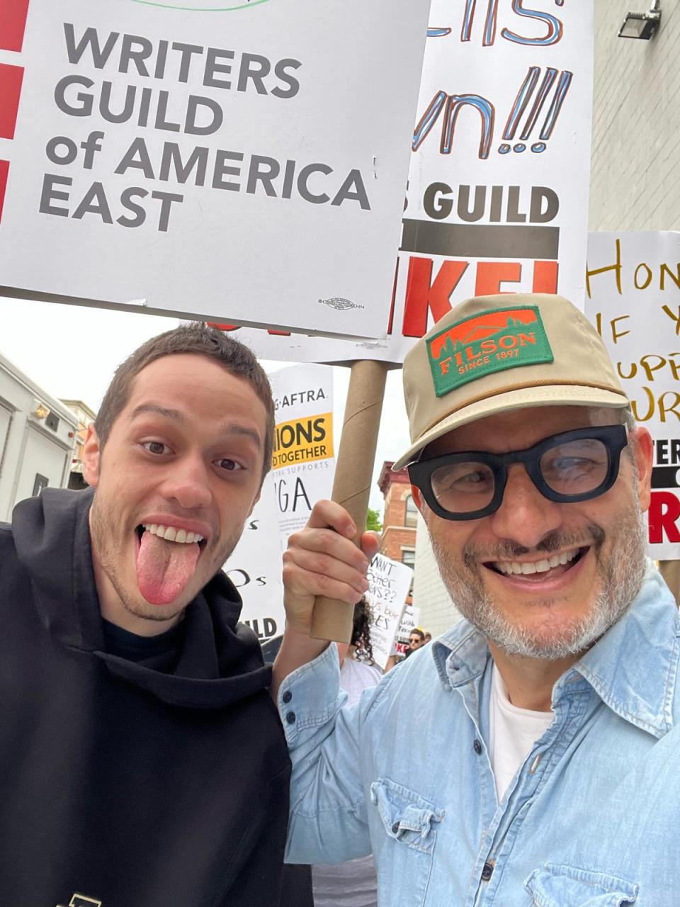 Pete Davidson and Judah Miller join members of the Writers Guild of America (WGA) and its supporters to picket on May 5, 2023 in New York City (Bruce Glikas/Getty Images)