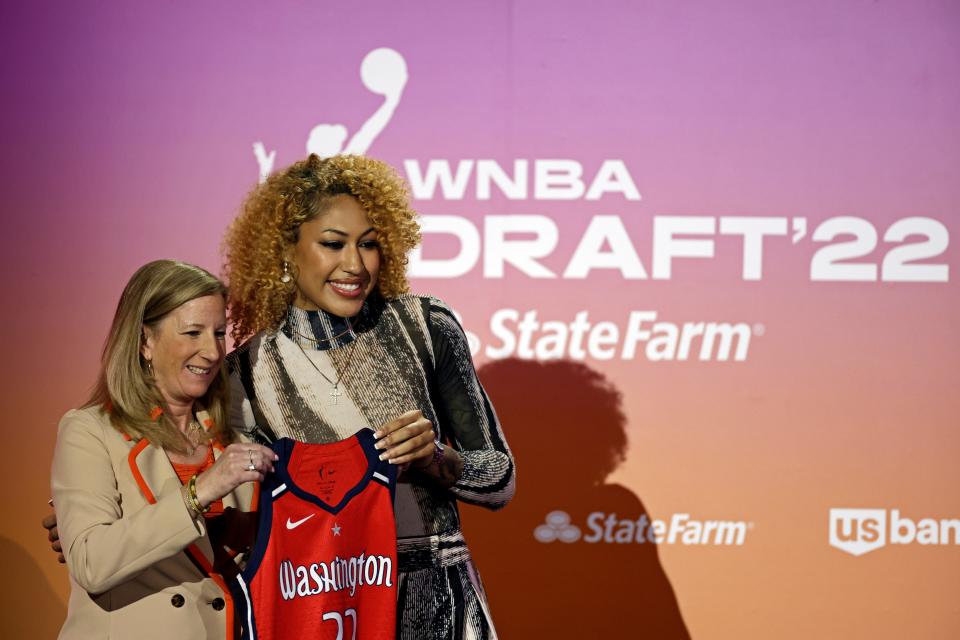Ole Miss' Shakira Austin, right, poses for a photo with commissioner Cathy Engelbert after being selected by the Washington Mystics as the third overall pick in the WNBA basketball draft, Monday, April 11, 2022, in New York.