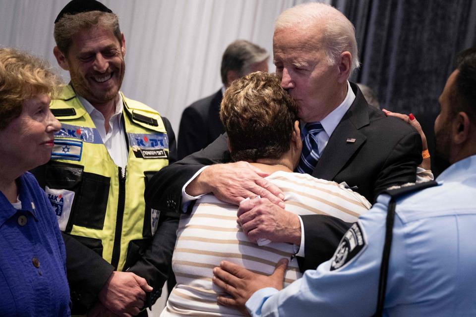 President Joe Biden hugs Rachel Edri, who was held hostage by the Palestinian militant group Hamas, during his visit to Israel on October 18, 2023. (Photo by Brendan Smialowski / AFP) (Photo by BRENDAN SMIALOWSKI/AFP via Getty Images)