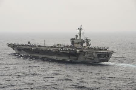 The aircraft carrier USS Theodore Roosevelt (CVN 71) transits the South China Sea in this U.S. Navy picture taken October 29, 2015. REUTERS/U.S. Navy/Mass Communications Specialist 3rd Class Anthony N. Hilkowski/Handout via Reuters