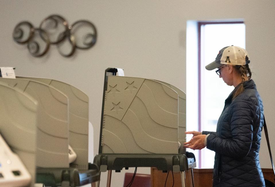 Kelli Biehle casts her ballot Tuesday at the Union Township Hall in Hebron.  Biehle said she voted for the township fire and EMS levy because it keeps the township with Granville fire, "and that's a plus for me."