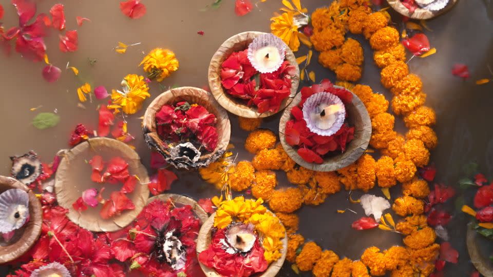 Flowers discarded in the River Ganges during religious festivals are a source of pollution. - CNN
