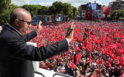 Turkish President Recep Tayyip Erdogan addresses citizens in Unye district during his visit to the flood hit province of Ordu, in the Black Sea Region of Turkey - Credit: Anadolu