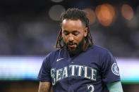 Seattle Mariners' J.P. Crawford walks off the field after he flew out with a runner on base to end the fifth inning of the team's baseball game against the Houston Astros, Friday, July 22, 2022, in Seattle. (AP Photo/Ted S. Warren)