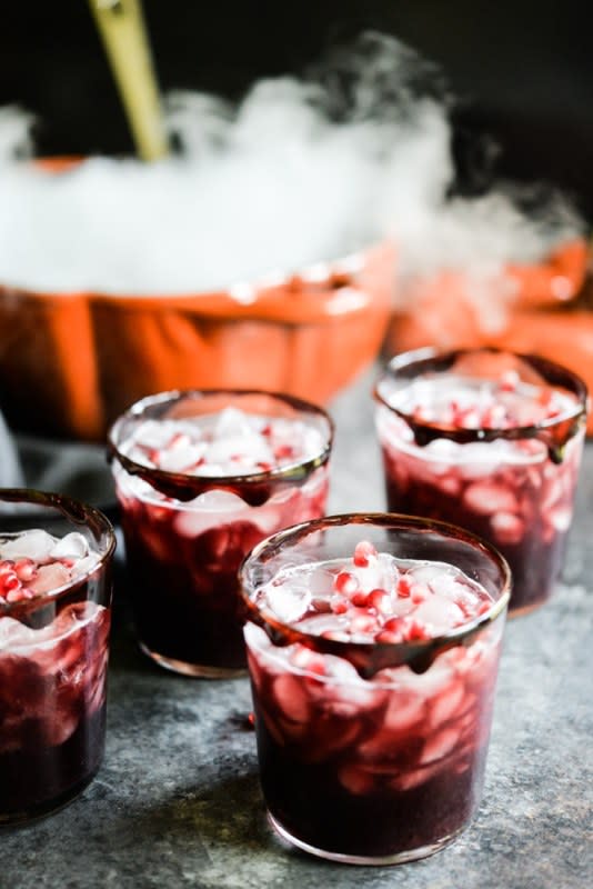 <p>Fed and Fit</p><p>This Witches’ Brew black sangria is tart, sweet and perfectly spooky! It’s made with tart cherry juice, pomegranates and a candied “blood” rim!</p><p><strong>Get the recipe: <a href="https://fedandfit.com/witches-brew-black-sangria/" rel="nofollow noopener" target="_blank" data-ylk="slk:Witches' Brew Black Sangria;elm:context_link;itc:0;sec:content-canvas" class="link rapid-noclick-resp"><em>Witches' Brew Black Sangria</em></a></strong></p>