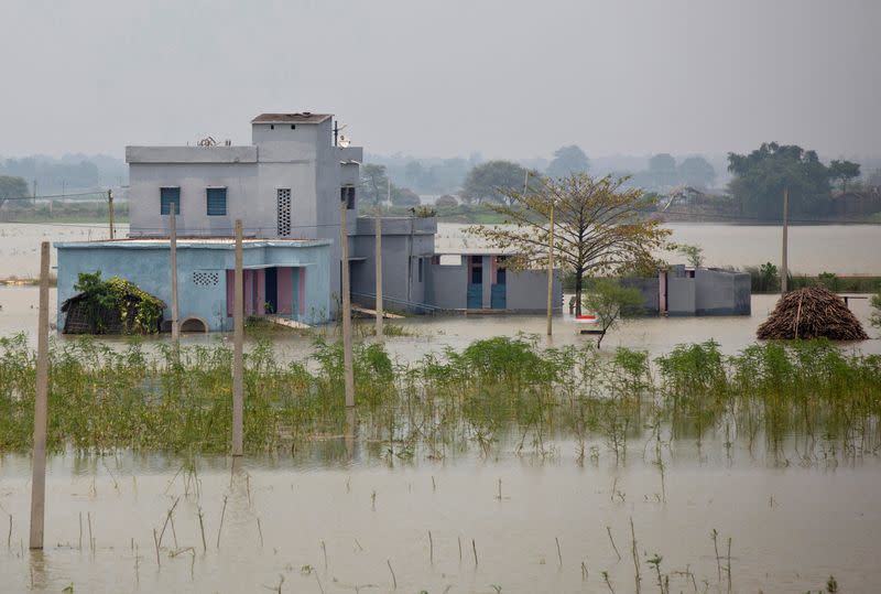 A partially submerged government building is seen in a flooded area in Bhagalpur district