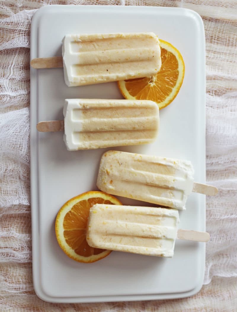 <strong>Get the <a href="http://www.abeautifulmess.com/2013/05/homemade-creamsicles.html" target="_blank">Creamsicle Popsicles recipe</a> from A Beautiful Mess</strong>