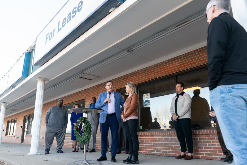 Sen. Rick Kloos, R-Topeka, stands next to his wife, Pennie Boyer-Kloos, as he thanks those in attendance for Thursday's announcement for the second location of God's Storehouse Thursday afternoon in east Topeka.