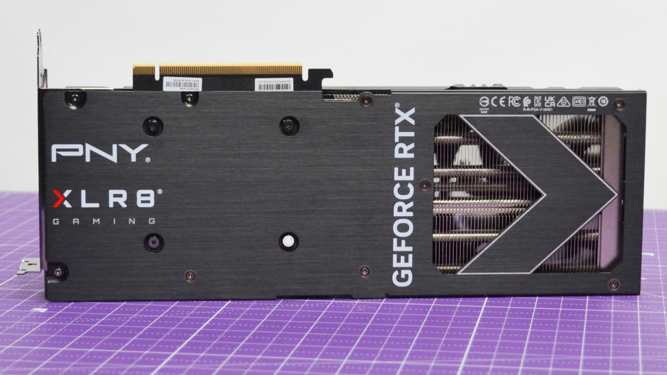 A PNY GeForce RTX 4070 XLR8 OC graphics card on a purple desk mat