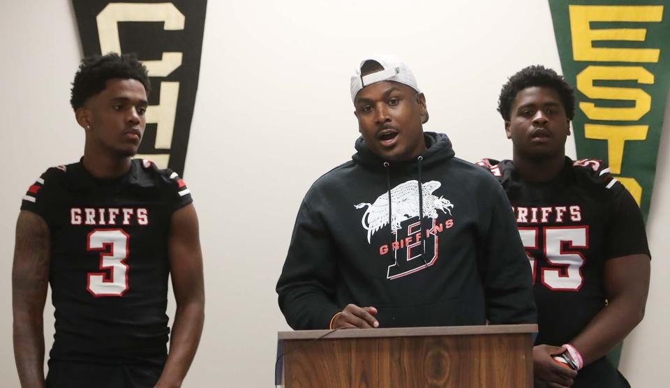 Buchtel head football coach Bryan Williams, center speaks during the Akron Public Schools Football Media Day as he stands between players Marcel Boyce Jr., left, and Tinell Edwards on Wednesday in Akron. 