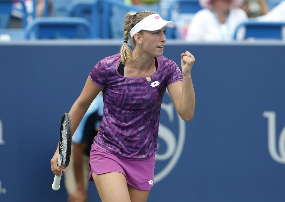 Elise Mertens, of Belgium, pumps her fist after winning a game against Caty McNally during first round play at the Western & Southern Open tennis tournament, Monday, Aug. 12, 2019, in Mason, Ohio. (AP Photo/Gary Landers)