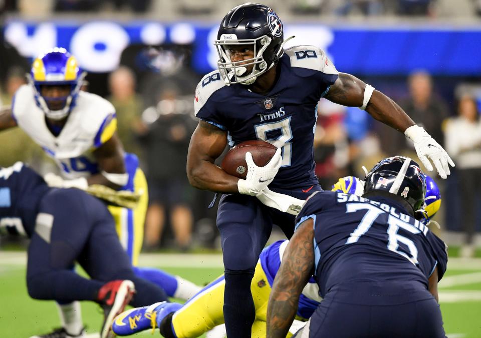 Tennessee Titans running back Adrian Peterson (8) spins out of a tackle during the first quarter at SoFI Stadium Sunday, Nov. 7, 2021 in Inglewood, Calif. 