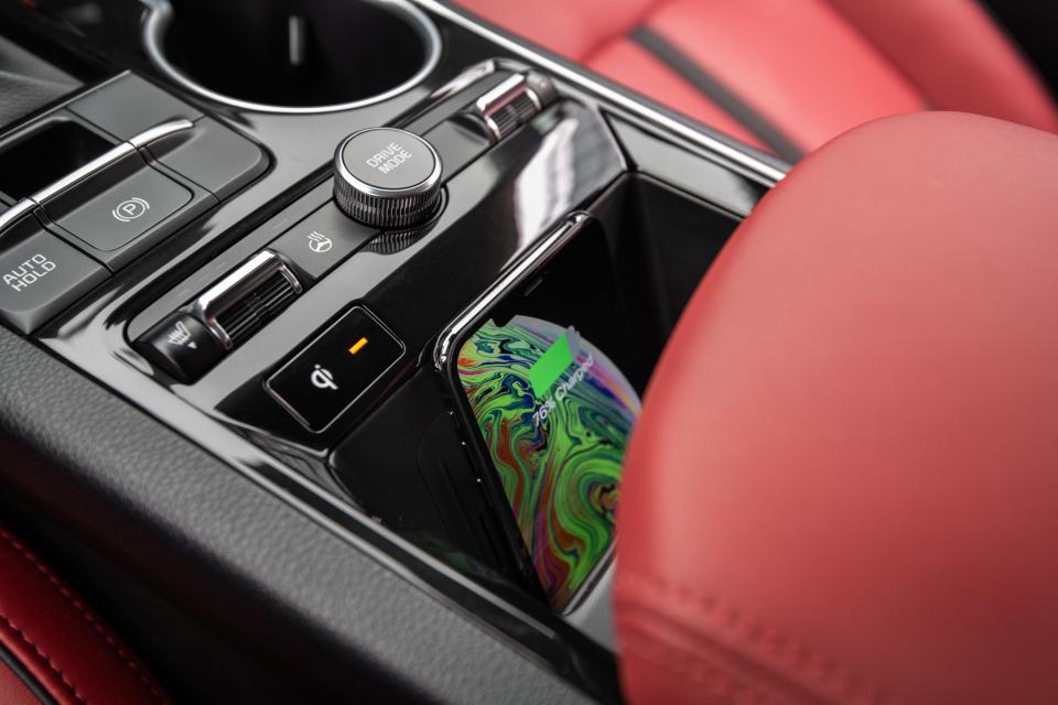 The Kia K5's wireless charger in the center console.