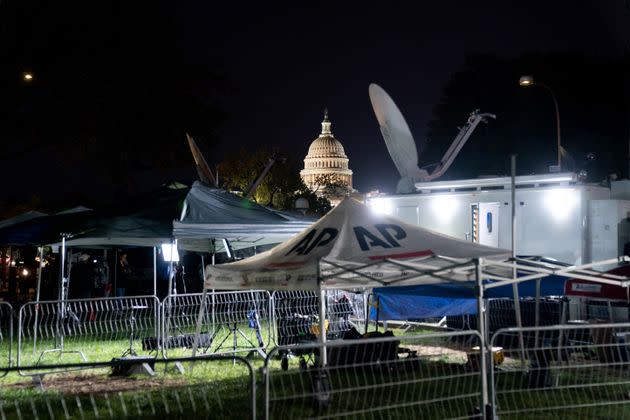 The U.S. Capitol is seen past media tents outside the E. Barrett Prettyman U.S. Courthouse early on Thursday.