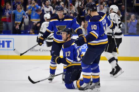 Oct 30, 2017; St. Louis, MO, USA; St. Louis Blues left wing Jaden Schwartz (17) celebrates with center Brayden Schenn (10) and defenseman Carl Gunnarsson (4) after scoring against Los Angeles Kings goalie Jonathan Quick (not pictured) during the second period at Scottrade Center. Mandatory Credit: Jeff Curry-USA TODAY Sports