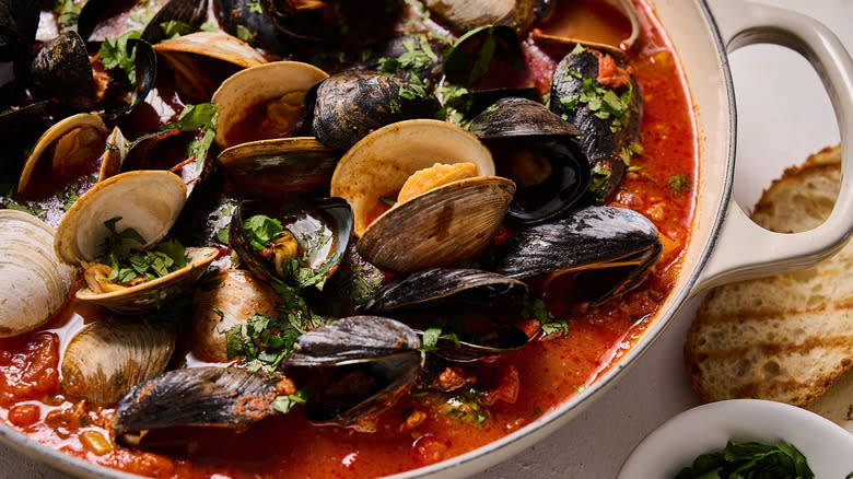 mussels and clams cooked in tomato broth with cilantro