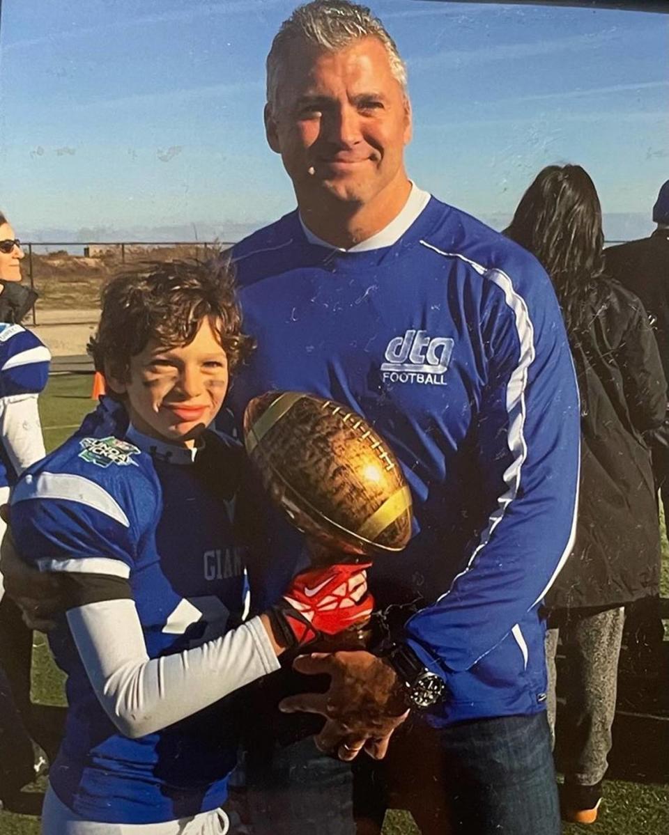 A young Declan McMahon with his dad, Shane McMahon, of WWE fame. Declan has interest in the family business.