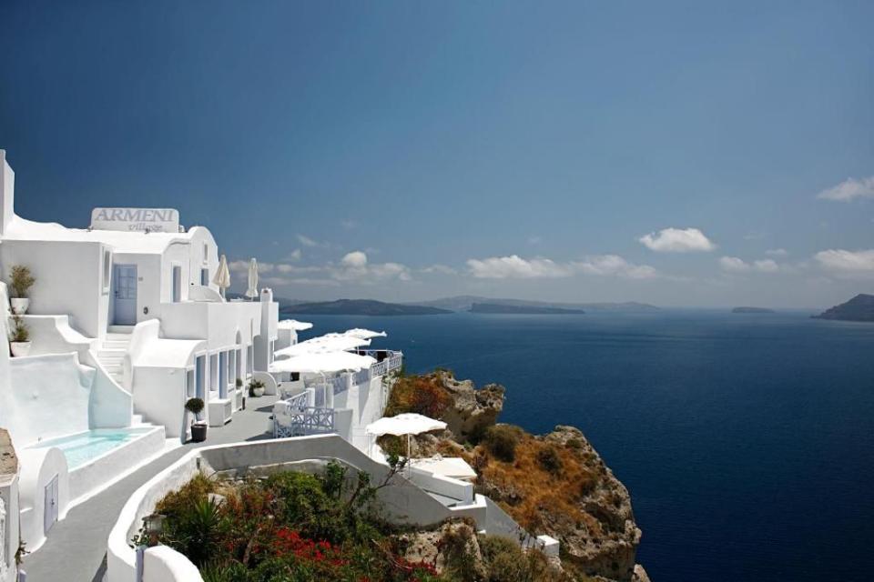 <p>Pastel doors and shutters - check. Curving stone walls - check. Blindingly white exteriors - check. <a href="https://www.booking.com/hotel/gr/armeni-village.en-gb.html?aid=2200764&label=best-hotels-santorini" rel="nofollow noopener" target="_blank" data-ylk="slk:Armeni Village;elm:context_link;itc:0;sec:content-canvas" class="link ">Armeni Village</a> is one for the chic-loving troglodytes out there. The Oia residence is on the caldera edge, 200 metres above sea level and a swift stroll from the centre of the village and its many boutiques, art galleries and churches. </p><p>The sea-facing suites – connected by various flights of stairs up and down the cliff face – have balconies or verandas from which to enjoy the view of the caldera and its volcanic islets. There’s no restaurant, but breakfast is delivered to your room, so you won’t have to tackle any steps without caffeine.</p><p><a class="link " href="https://www.booking.com/hotel/gr/armeni-village.en-gb.html?aid=2200764&label=best-hotels-santorini" rel="nofollow noopener" target="_blank" data-ylk="slk:CHECK AVAILABILITY;elm:context_link;itc:0;sec:content-canvas">CHECK AVAILABILITY</a></p>