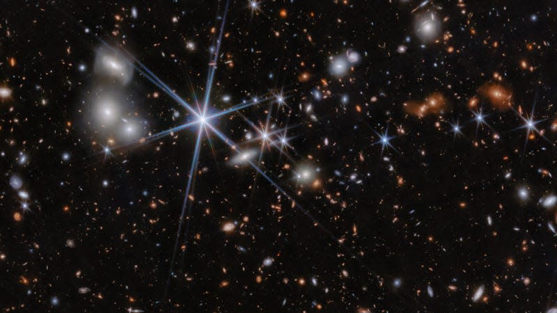 A field image of space that contains the galaxy system ZS7. - Image: <a class="link " href="https://esawebb.org/images/weic2413a/" rel="nofollow noopener" target="_blank" data-ylk="slk:ESA/Webb, NASA, CSA, J. Dunlop, D. Magee, P. G. Pérez-González, H. Übler, R. Maiolino, et. al;elm:context_link;itc:0;sec:content-canvas">ESA/Webb, NASA, CSA, J. Dunlop, D. Magee, P. G. Pérez-González, H. Übler, R. Maiolino, et. al</a>