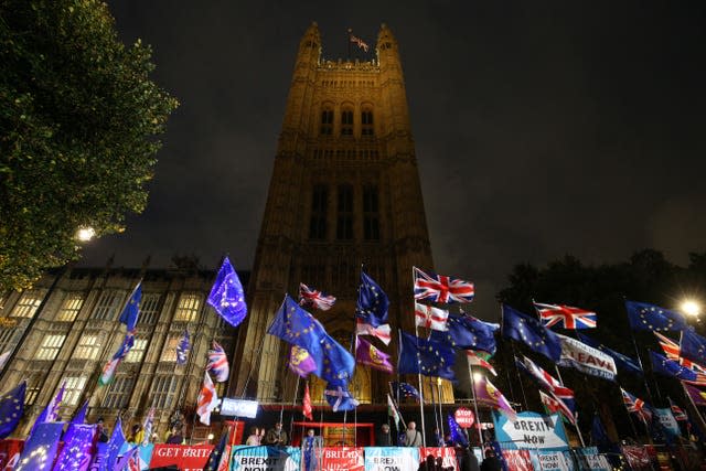 EU and Union flags at the foot of the Elizabeth Tower, at the Palace of Westminster 