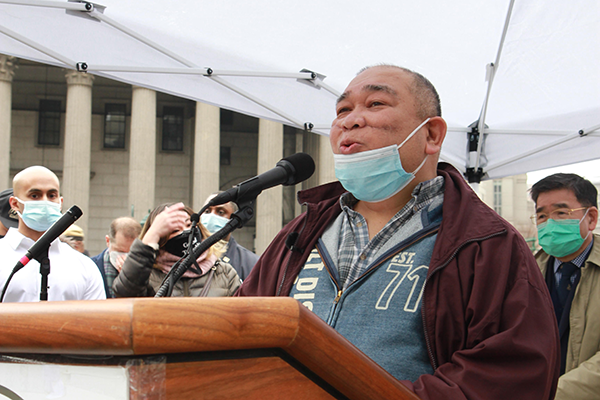 Noel Quintana, whose face was slashed in on the subway in early February, speaks at the Anti-Asian Hate Rally on Saturday, February 27, 2021. / Credit: Anokha Venugopal / Asian American Federation