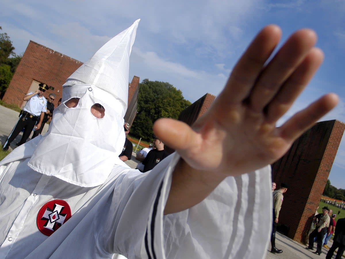 A member of the Ku Klux Klan salutes during American Nazi Party rally (file photo)  (William Thomas Cain/Getty Images)