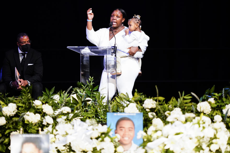 Dominique Cook speaks during funeral services for the victims of a deadly row house fire, at Temple University in Philadelphia, Monday, Jan. 17, 2022. Officials say it's the city's deadliest single fire in at least a century. (AP Photo/Matt Rourke)