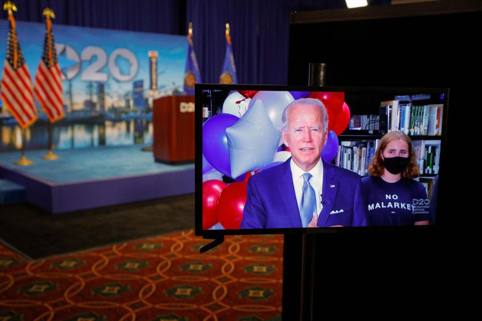 Joe Biden reacts in a video feed from Delaware after winning the votes to become the Democratic Partys 2020 nominee for president (POOL/AFP via Getty Images)