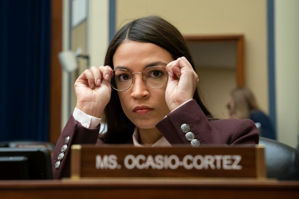 Rep. Alexandria Ocasio-Cortez, D-N.Y., is one of 25 Democrats on the House Oversight and Reform Committee that is holding a hearing Wednesday morning to examine the gun violence epidemic gripping the nation. This file photo shows her at a House Oversight hearing on July 26, 2019.