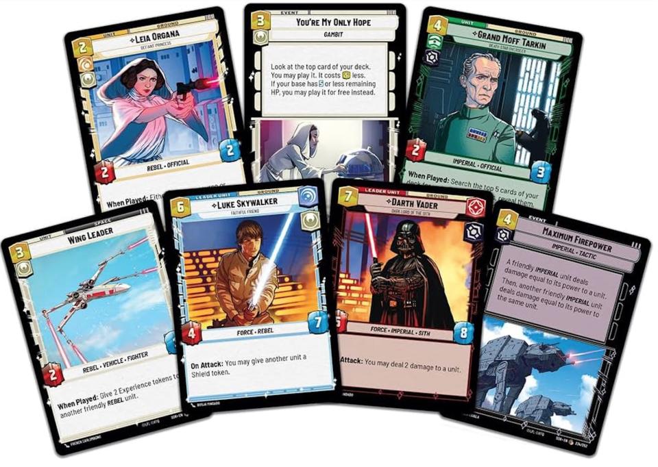 seven star wars playable trading cards, seen against a white background