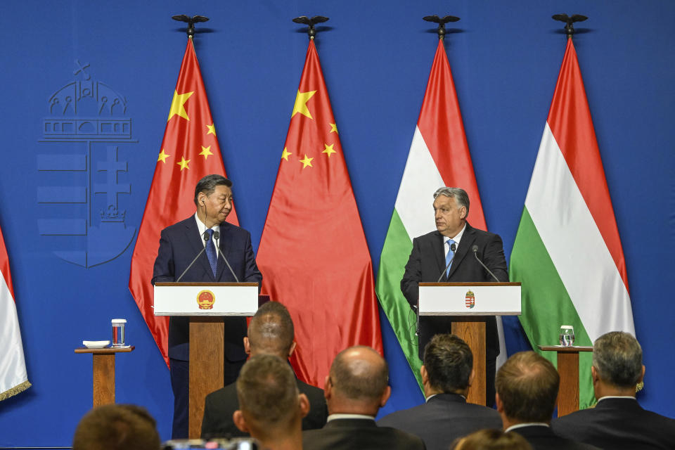 Chinese President Xi Jinping, left, speaks during his joint press conference with Hungarian Prime Minister Viktor Orban following their talks at the PM's office, the former Carmelite Monastery, in Budapest, Hungary, Thursday, May 9 2024. (Szilard Koszticsak/MTI via AP)