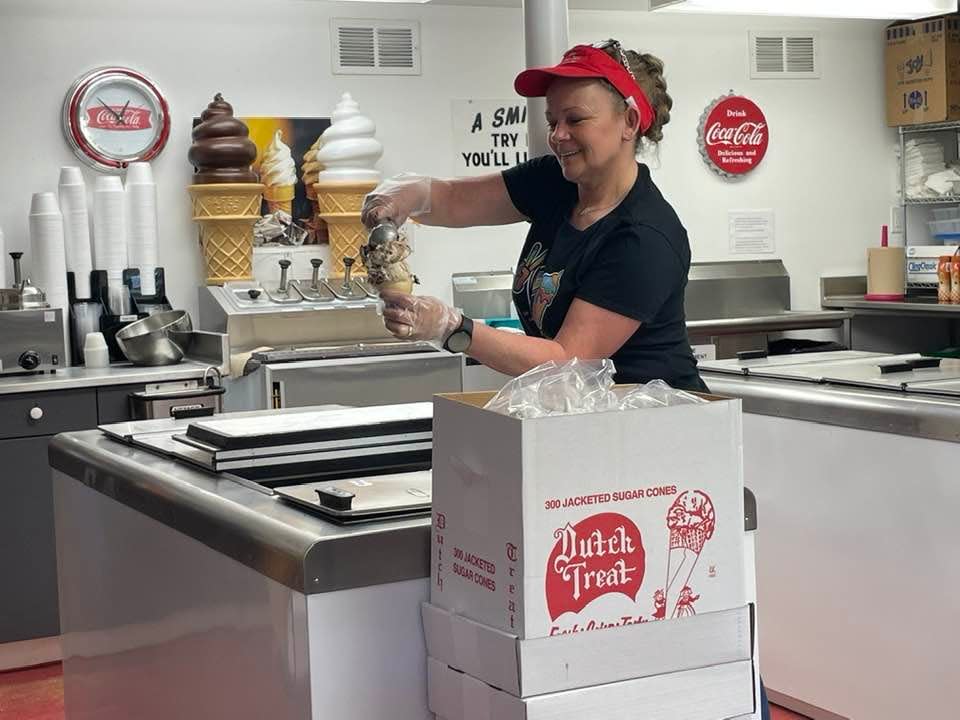 Millie's Ice Cream owner Julie Malerba scoops a cone on Friday.