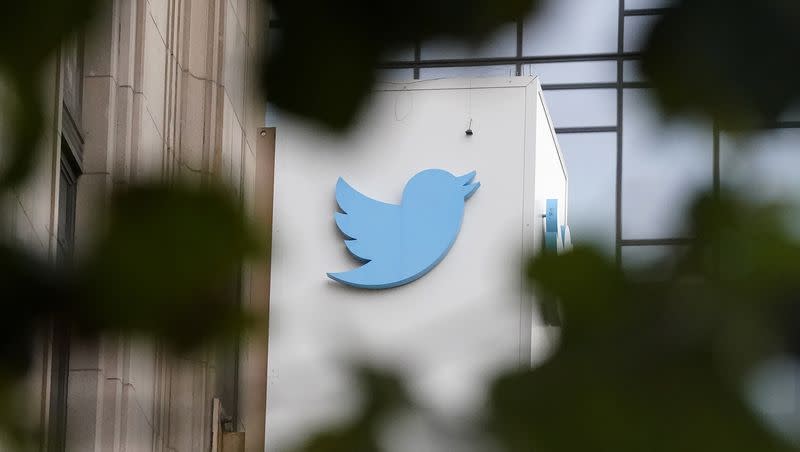 A sign at Twitter headquarters is shown in San Francisco, Dec. 8, 2022. Twitter rolled out Verified Organizations feature and news organizations across the country are refusing to pay for it. 