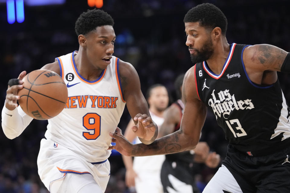 New York Knicks guard RJ Barrett (9) drives against Los Angeles Clippers guard Paul George (13) in the first half of an NBA basketball game, Saturday, Feb. 4, 2023, at Madison Square Garden in New York. (AP Photo/Mary Altaffer)