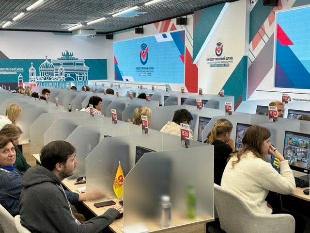 Election observers and party representatives view livestreams of polling locations from a central viewing location in Moscow during elections in September 2023.