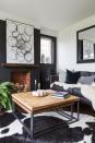 <p> Black isn&#x2019;t often a color we consider as a living room color, but take a tip from the Scandinavians: it works. </p> <p> Here, a black living room looks fabulous contrasted with crisp off-white paint, but bear in mind that the key to getting the finish right is balance. In other words, break up the black with plenty of white: on ceilings, flooring, and other walls. </p> <p> Introduce texture and warmer tones, too, with accessories. In this living room, pendant lights, the artwork on the sideboard, and the white and wood tones of the sideboard itself all provide relief. </p>