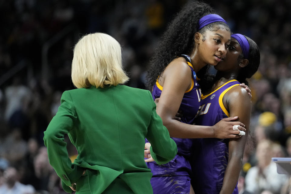 LSU forward Angel Reese (10) and LSU guard Flau'jae Johnson (4) talk as Reese leaves the court during the fourth quarter of an Elite Eight round college basketball game during the NCAA Tournament, Monday, April 1, 2024, in Albany, N.Y. (AP Photo/Mary Altaffer)