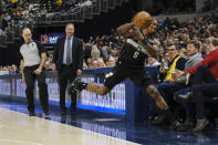 Milwaukee Bucks guard Eric Bledsoe (6) tries to save the ball from going out of bounds during the second half of the team's NBA basketball game against the Indiana Pacers in Indianapolis, Wednesday, Feb. 12, 2020. The Pacers won 118-111. (AP Photo/AJ Mast)