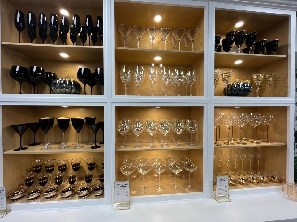 Shelves of glassware at Gay Fad Studios.