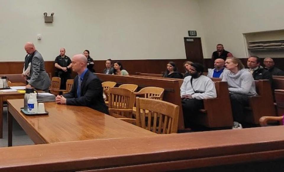 Whatcom County Chief Criminal Deputy Prosecuting Attorney Erik Sigmar (right) and senior conflict defense attorney Ryan Swinburnson (left) look on as Shilo Aron Englert, of Bellingham, pleads guilty to second-degree manslaughter for the Feb. 8, 2022 shooting death of Kasaundra “Kassy” May Booker in a packed courtroom in Whatcom County Superior Court on Wednesday, June 12, 2024.