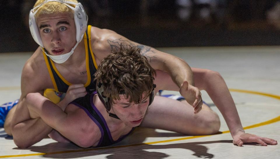 St. John Vianney's Anthony Knox (top) pinned Rumson-Fair Haven's Elijah Bayne in the 120-pound bout in the Lancers' 44-26 win Wednesday night.