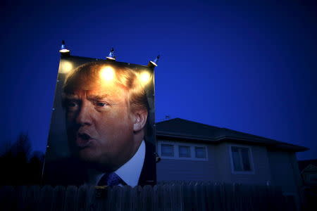 A picture of Donald Trump hangs outside a house in West Des Moines, Iowa. REUTERS/Jim Young