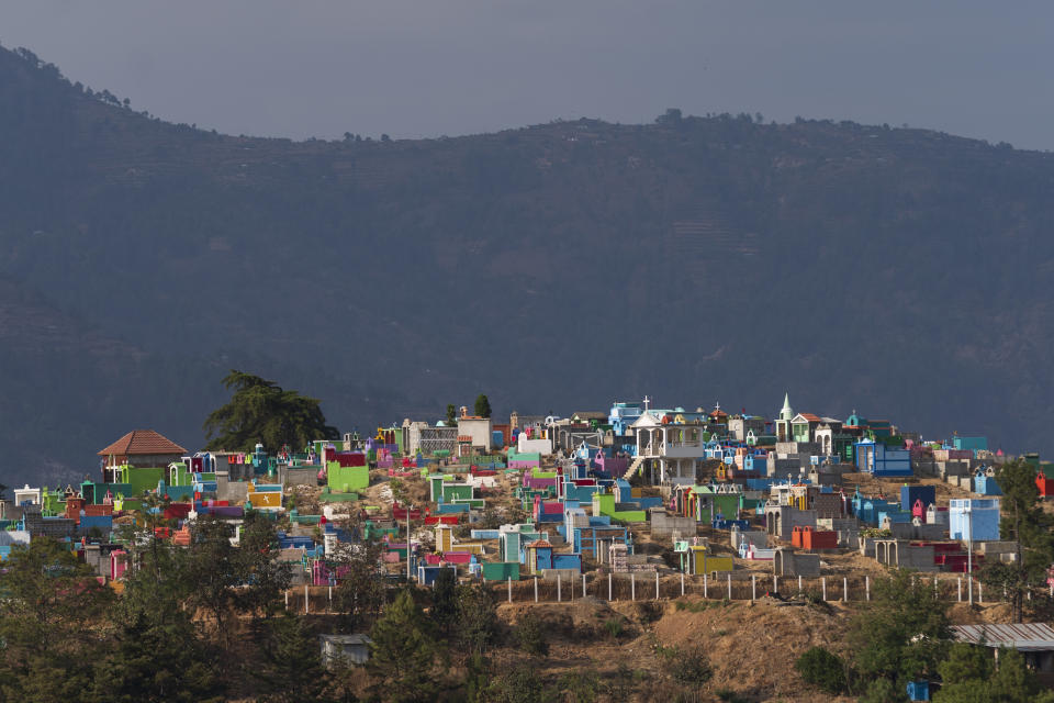 Tombs stand in the main cemetery on the outskirts of Comitancillo, in the Indigenous Western Highlands of Guatemala, Tuesday, March 19, 2024. In this small town, nearly two dozen local migrants have died in recent mass tragedies: either asphyxiated in the trailer in San Antonio, Texas, in June 2022 or shot and set afire by rogue police officers in Camargo, Mexico, in January 2021. (AP Photo/Moises Castillo)